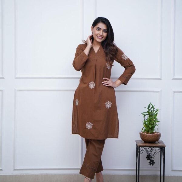 classy kurti manual tagai work detailing & moti work with tussles on neckline